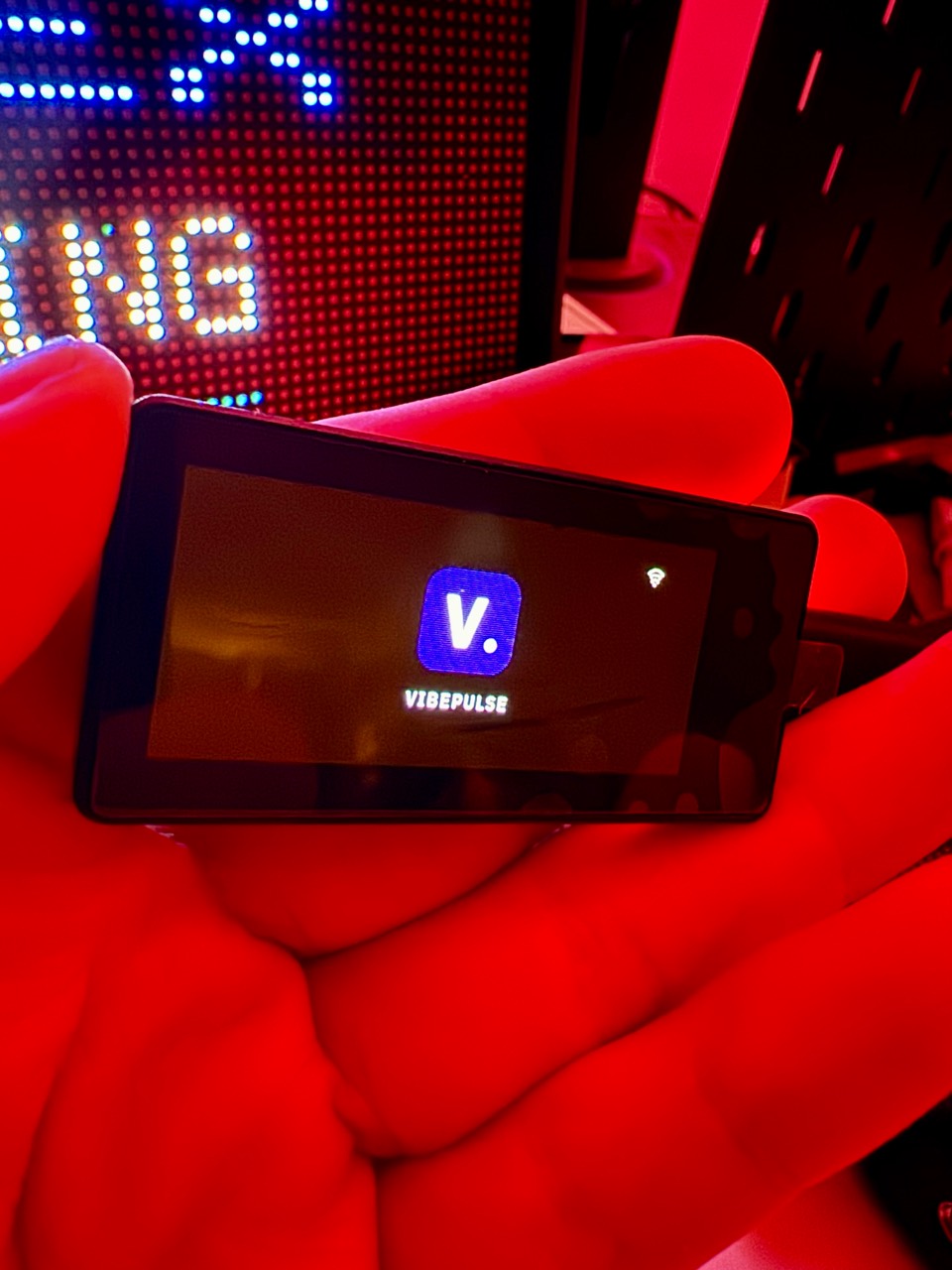 Owner photograph of the real 1.91-inch panel showing the VibePulse startup logo