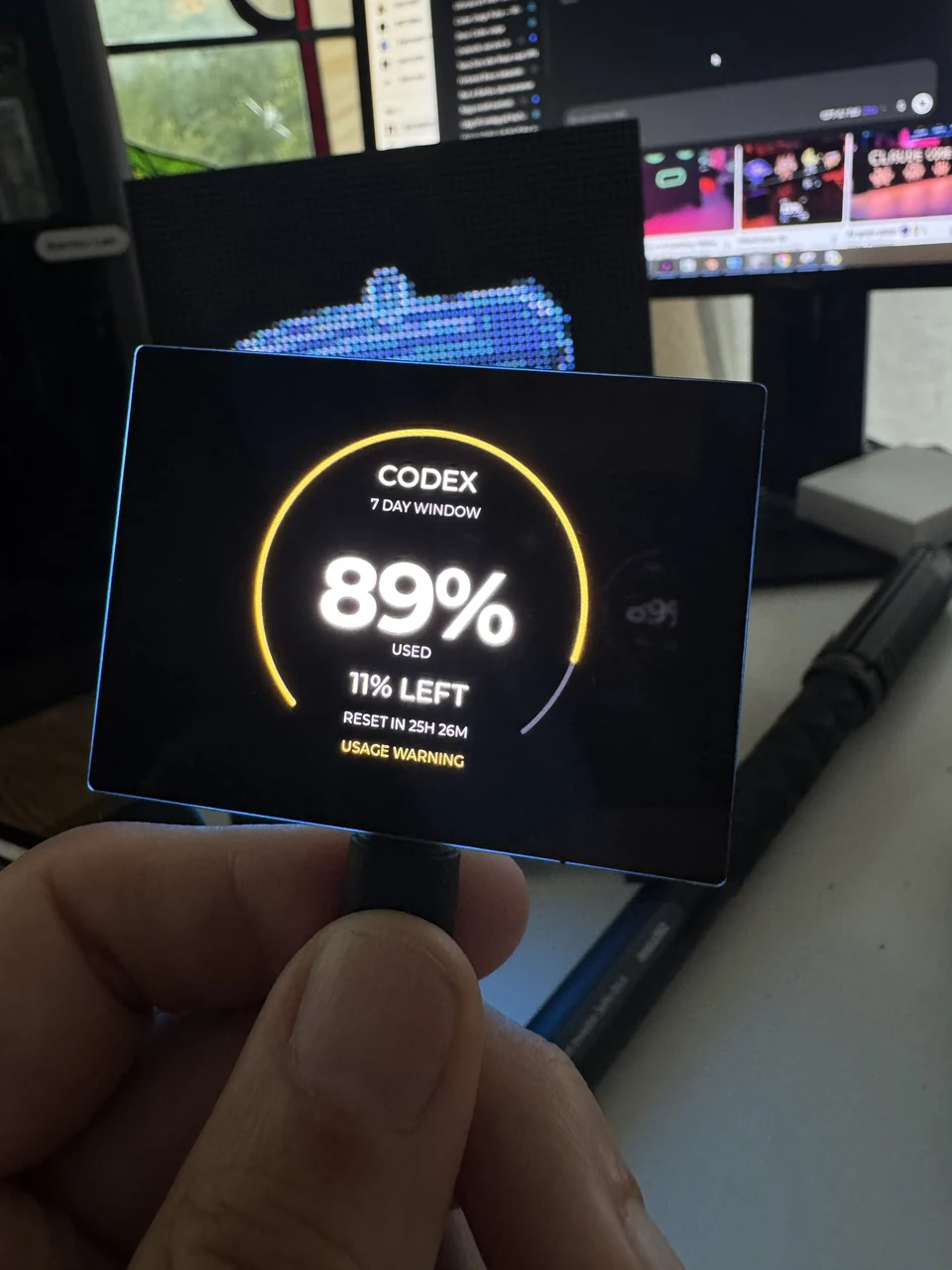 Physical Codex display showing 89 percent of the seven-day quota used, 11 percent left and a usage warning