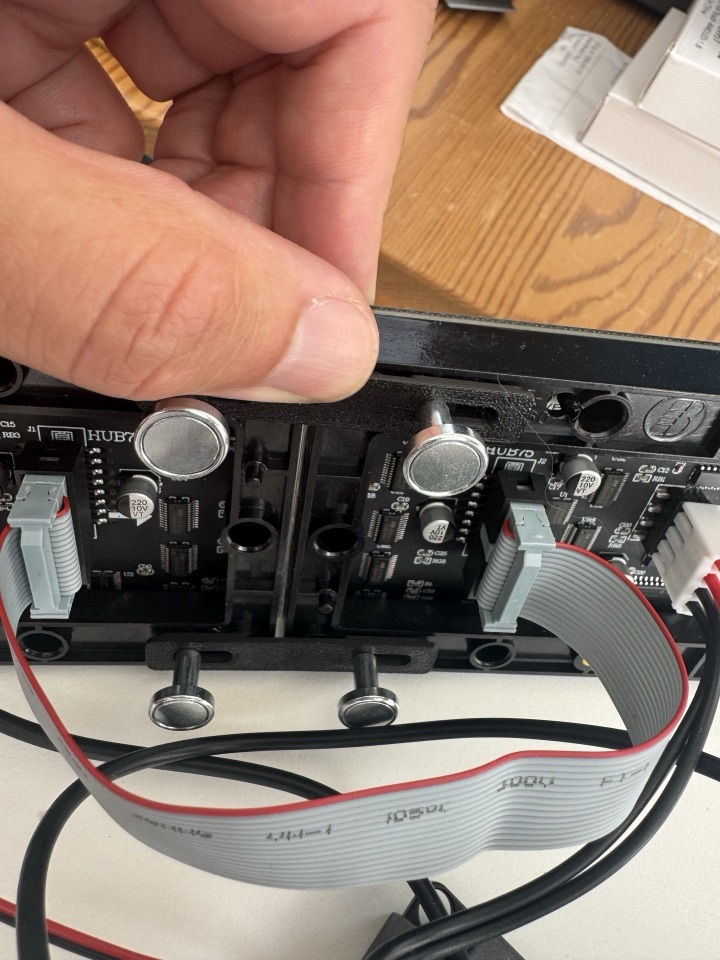 Close view of the rear panel mounts, ribbon connector and printed supports
