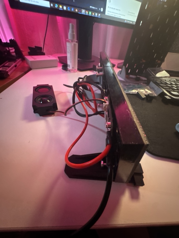Separate speaker beside the LED matrix, viewed from the side
