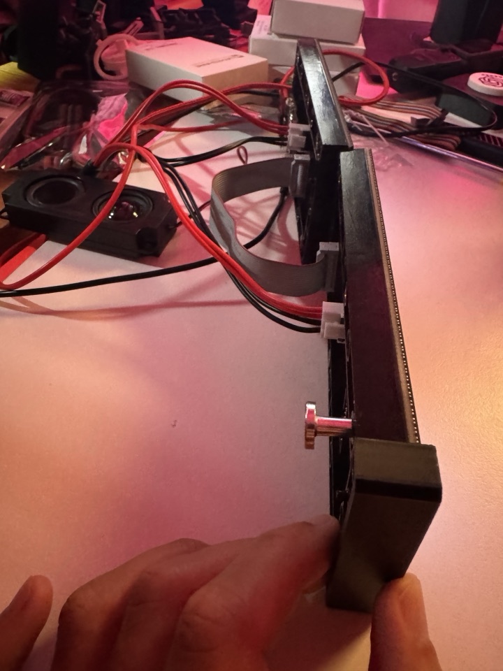 Side view of the matrix panels, ribbon cable and speaker wiring on the workbench